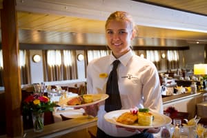 The River Cruise Line MPS Lady Anne Interior Restaurant Waitress.jpg