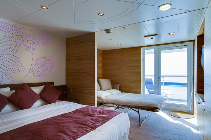 Cruise & Maritime Voyages Magellan Accommodation Junior Suite Bedroom With Sofa Bed Down.jpg