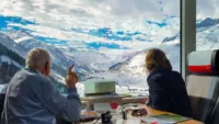 Man Points At Swiss Alps From The Glacier Express Credit Unsplash