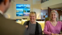 Guests coming on board Ambassador Cruise Line ship