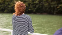 Person on river cruise Credit canva
