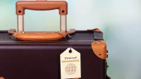 Travel insurance suit case min
