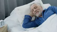 Man in bed min
