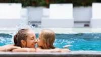 Mom and daughter swim