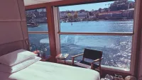 Drop-down windows maximize views of the river. Credit: Emerald Cruises