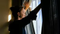 Woman at window min