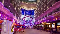 Enjoy the many venues that greet you as you saunter down the Boardwalk. Credit: Royal Caribbean