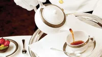 The charming British tradition of afternoon tea is included on cruise lines like Cunard. Credit: Cunard