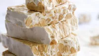 Do try turrón, a revered Spanish nougat candy.