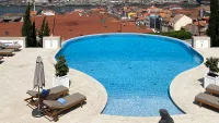 A stay at The Yeatman Hotel, with its vase-shaped pool, should be on your Porto itinerary. Credit: Kaye Holland