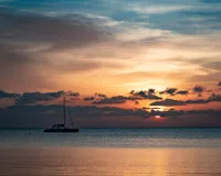 Watch the sun set with a Red Stripe. Credit: Shutterstock