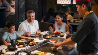Umai Teppanyaki, an art-filled space where the chef fries fish, chicken and beef on a hotplate in front of you. Credit: Princess Cruises