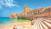 For a resort experience, head to St Julian’s Bay. Credit: Shutterstock