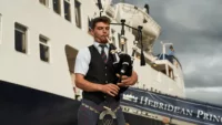 Hebridean Island Cruises bagpipes tartan