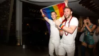 Olympic medalist and Pride Party at Sea Grand Marshal Adam Rippon celebrating Pride Month with Celebrity Cruises alongside both guests and crew on board the brands newest ship Celebrity Edge Rea 1