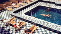 Guest in Pavilion Pool Credit Cunard