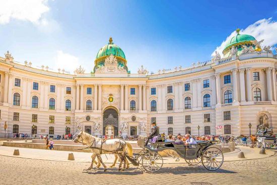 Horse and carriage outside Alte Hofburg, Vienna, Austria