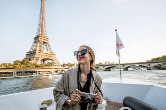 Lady sightseeing on a boat in Paris