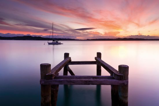 Beautiful sunset overlooking water Bay of Islands