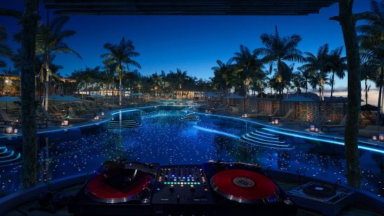 Virgin Voyages Beach Club at Bimini at night, where Mark Ronson will perform