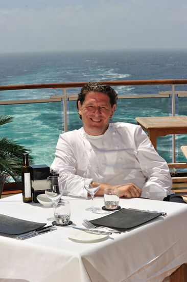 Marco Pierre White sitting out on deck on board P&0 Cruises ship as one of their Food Heroes