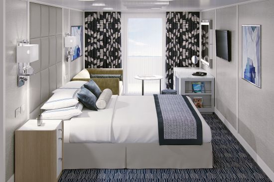 Oceania Cruises Concierge Veranda stateroom with bed and blue furnishings