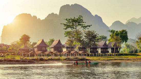 Village and bungalows along Nam Song River in Vang Vieng, Laos