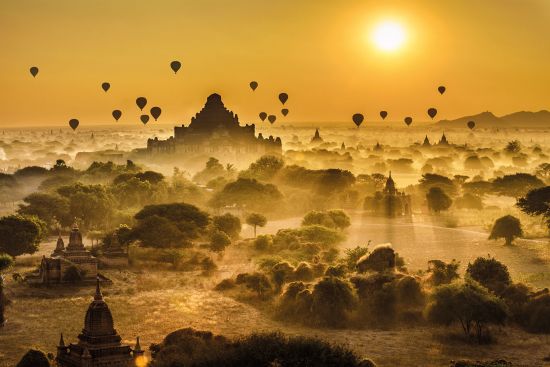 Dawn balloon flight over Myanmar Asia river