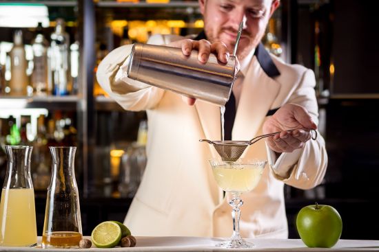 Barman making cocktail