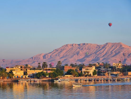 River cruise on the Nile with a hot air balloon in background